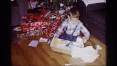 Michigan (1959): Kid Opening One Of His Christmas Presents