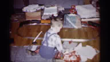 Michigan (1959): Little Boy Playing With Trains At Christmas Time