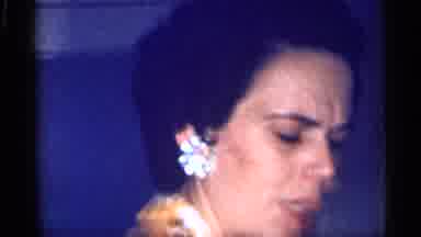 Michigan (1959): Indoor Video Showing A Woman Wearing Earrings And Later An Older