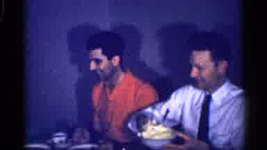 Michigan (1959): Family Passes Food Around Table As They Enjoy Each Other's