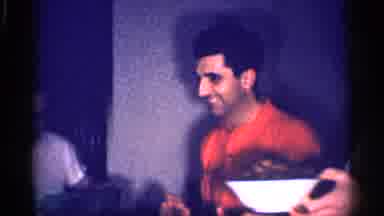 Michigan (1959): A Woman And Three Men Are Eating All Together Having Fun