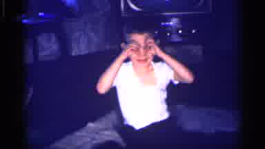Michigan (1959): A Child With A White Shirt Putting His Fingers Around His Eyes