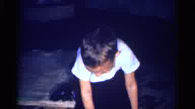 Michigan (1959): Child In White Tee Shirt Upset As He Sits Upon The Ground