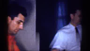 Michigan (1959): Indoor Video Showing Two Man And A Child With A Spoon In His Hand