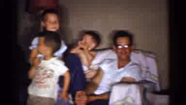 Michigan (1959): A Group Of Two Adults And Five Small Children In A Living Room
