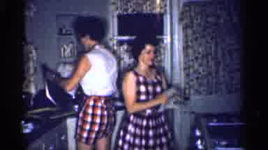 Michigan (1959): Two Smiling Woman Are Tidying Up A Very Small Kitchen
