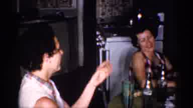 Michigan (1959): A Family Members Enjoys Their Food With Their Children Out In The