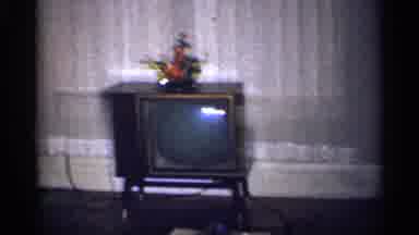 Michigan (1959): A Family Members Enjoys Their Food With Their Home Out In The