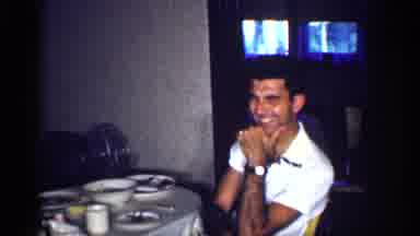 Michigan (1959): Home Video Of Man Laughing And Woman Gesturing At Dinner Table