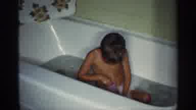 Michigan (1959): Little Boy Busy Playing The Tub During Bath Time