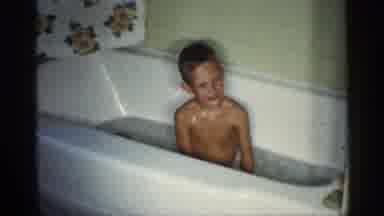 Michigan (1959): A Boy Is Enjoying The Dub Water And Cleans Himself