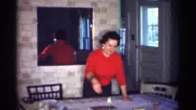 Michigan (1959): Two Woman One In White The Other In Red Clearing The Dinner Table