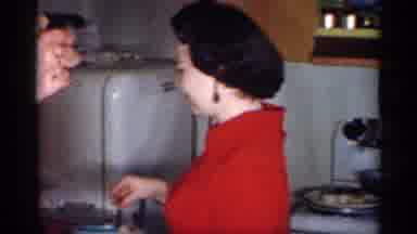 Michigan (1959): Man Woman Kitchen Cooking Putting Groceries Away
