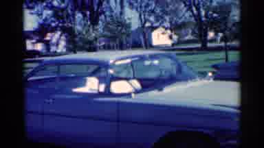 Michigan (1959): A Pair Of Blue Cars Paled On A Bright Sunny Day