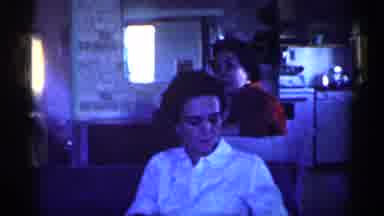 Michigan (1959): Woman Wearing White Shirt Shields Face From Camera With Hand