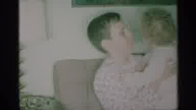 New York (1959): Indoor Video Showing A Young Man Playing And Holding A Child In