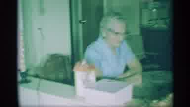 New York (1959): Vintage Footage Man With Glasses Sitting Looking At A Child