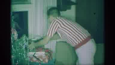 New York (1959): Boy Picks Up Wrapped Christmas Present Points To Himself Sets
