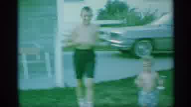 New York (1959): Boy Wearing Black Shorts Points At Toddler Wearing Light Blue