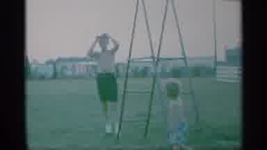 New York (1959): Man Waves And Climbs Ladder In Field With Child Watching Him