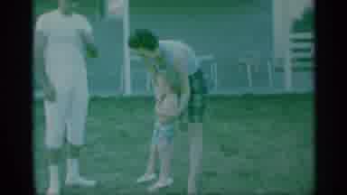 New York (1959): Kids Being Assisted In Playing With A Swing Set