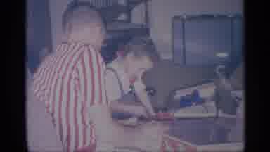 New York (1959): A Kid Getting A Train Set On Christmas In A Family Room