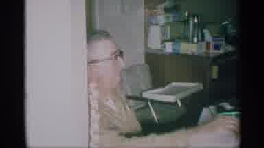 New York (1959): Old Woman With Glasses Unwrapping Present Of A Sweater While