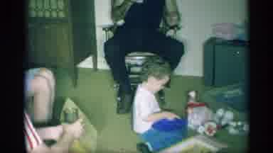 New York (1959): Child Sitting Around His Parents And Playing With Toys