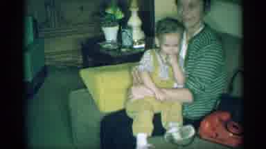 New York (1959): Child Sitting On His Mother Lap While A Man Laughs And Another
