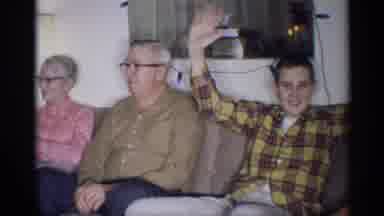 New York (1959): Man Wearing Red And Yellow Plaid Shirt Waves Both Hands In Air