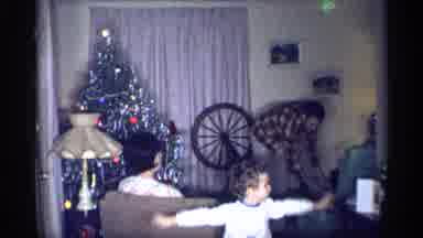 New York (1959): Child Wearing White Shirt Fly Like Airplane In Living Room