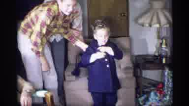 New York (1959): A Child In A Living Room Taking Their Jacket Off To Open Presents
