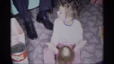 New York (1959): Little Child Playing With Her New Doll On The Kitchen Floor