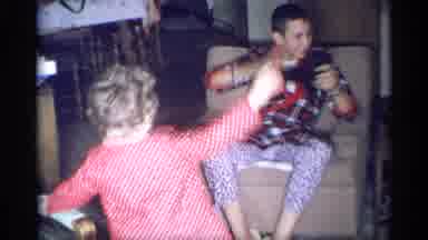 New York (1959): Indoor Recording Showing A Young Man And A Child Waving At The