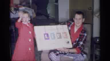 New York (1959): Opening A Board Game With Family In Their Pajamas In The City