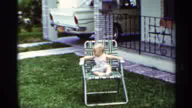 Mississippi (1963): Baby Sitting In A Lawn Chair While A Person Rides A Bike