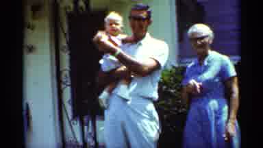 Mississippi (1963): Woman Wearing Blue Shorts Helps Baby Wearing White Shorts To