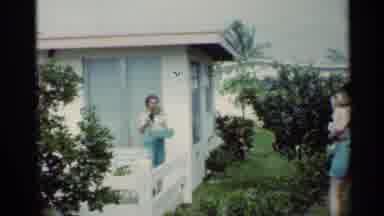 Mississippi (1963): A Woman Dressed In Summer Clothing And Holding A Baby Talks To