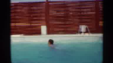 Mississippi (1963): Man Wearing Black Shorts Dives Into Swimming Pool On A Sunny
