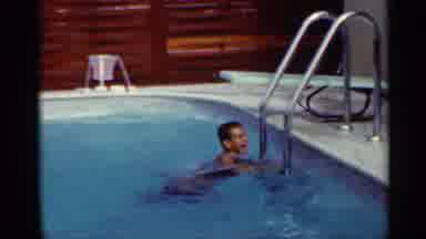 Mississippi (1963): Two Young Boys Climbing Out Of Clear Blue Pool And Jumping In