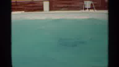 MISSISSIPPI-1963: Boy Slides Into Pool, Swims, and Climbs Out on 8mm Film
