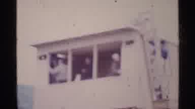 Ohio USA (1969): A Group Of People On Top Of A Building Looking Down At The People