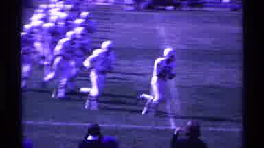 Ohio USA (1969): Football Game Underway Band On Sidelines Players Run Onto Field