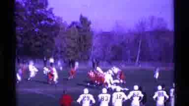 Ohio USA (1969): A Group Of Sports Are Playing The Rugby Around The Ground