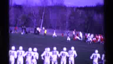 Ohio USA (1969): Parents Nervously Watch From The Sidelines Of A Football Game