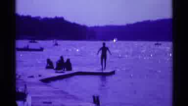 Ohio USA (1969): At Vacation A Family Gathers On The Shore While Other Vacationers