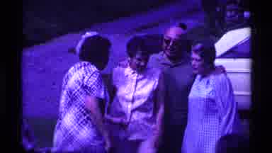 Ohio USA (1969): Woman Joins The Others Who Are Standing Together Posing For A
