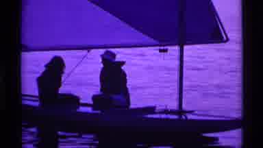 Ohio USA (1969): People Sitting On A Sailboat Sailing While Others Watch From The
