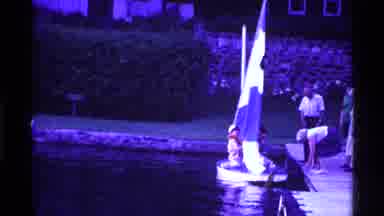 Ohio USA (1969): People Standing Around While One Person Is Inside A Boat Trying