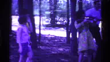 Ohio USA (1969): In An Open Space There Are Some Trees And Some People In